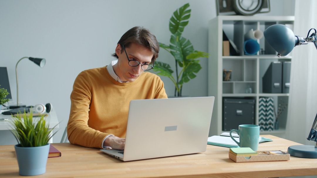 Contractor reviewing SEO data and marketing analytics on a laptop at a desk